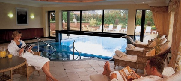 Relaxing in chairs next to indoor pool